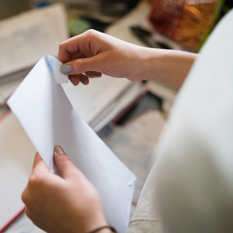 woman opening mail